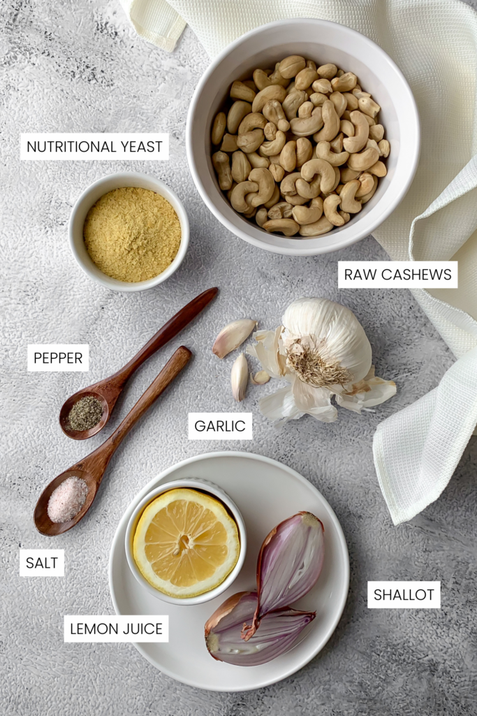 dairy-free Alfredo sauce ingredients infographic; cashews, nutritional yeast, lemon, shallot, garlic, salt and pepper