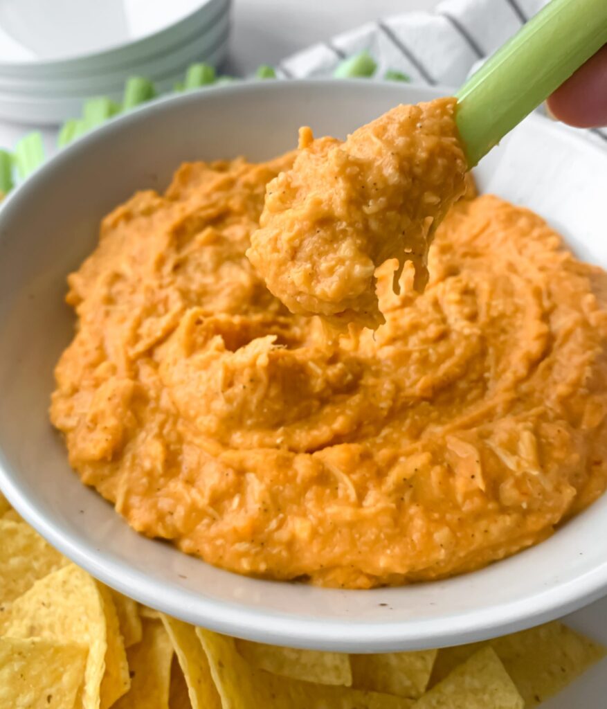 close up of dairy free buffalo chicken dip on celery