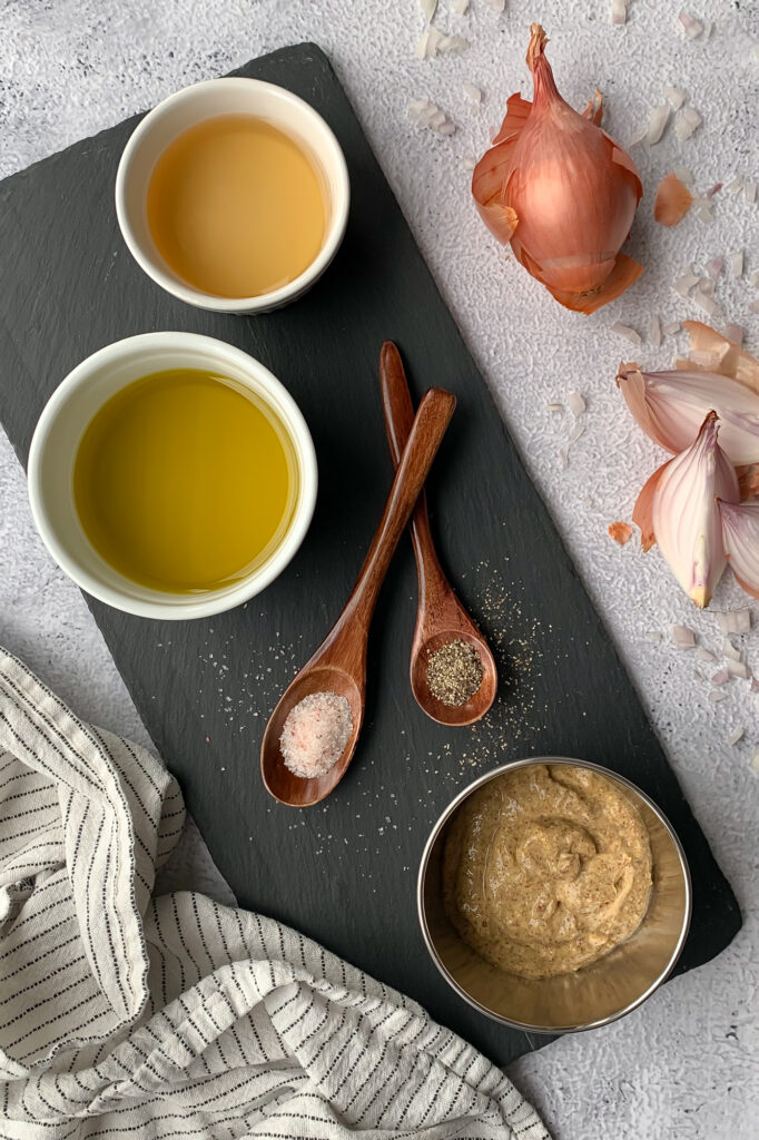 dijon dressing ingredients; shallots, olive oil, vinegar, Dijon mustard, salt and pepper