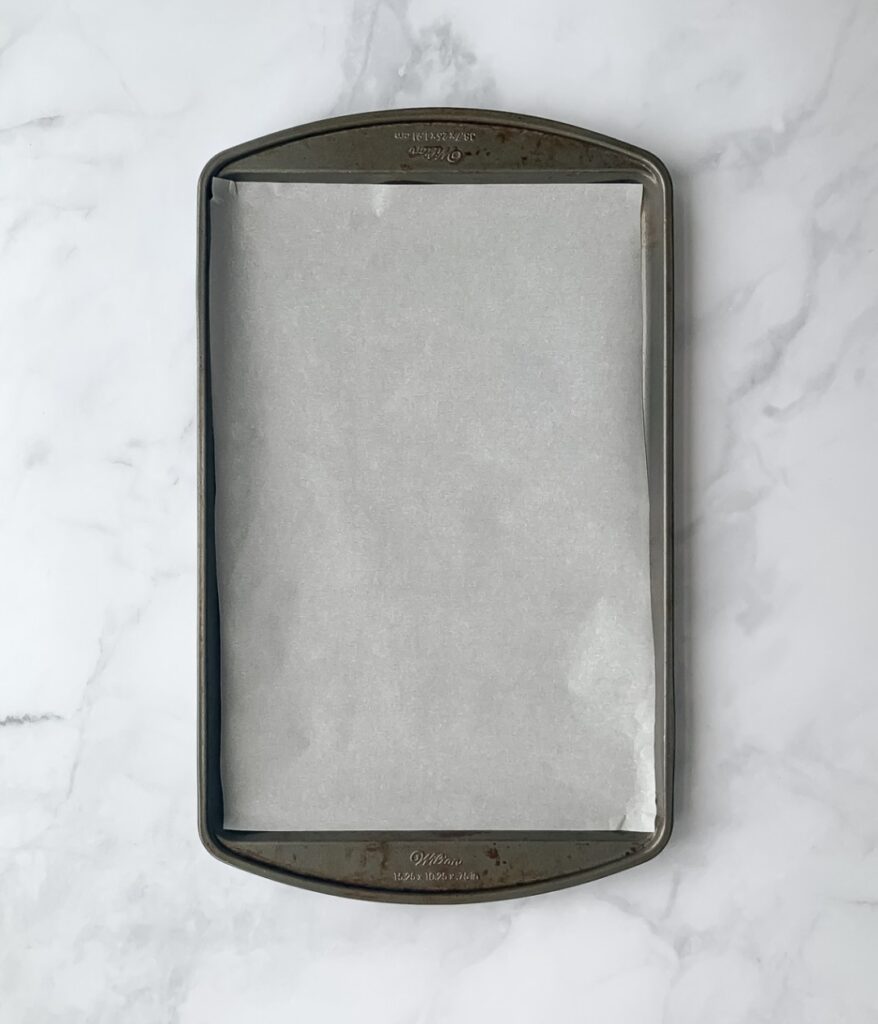 metal sheet pan lined with parchment paper