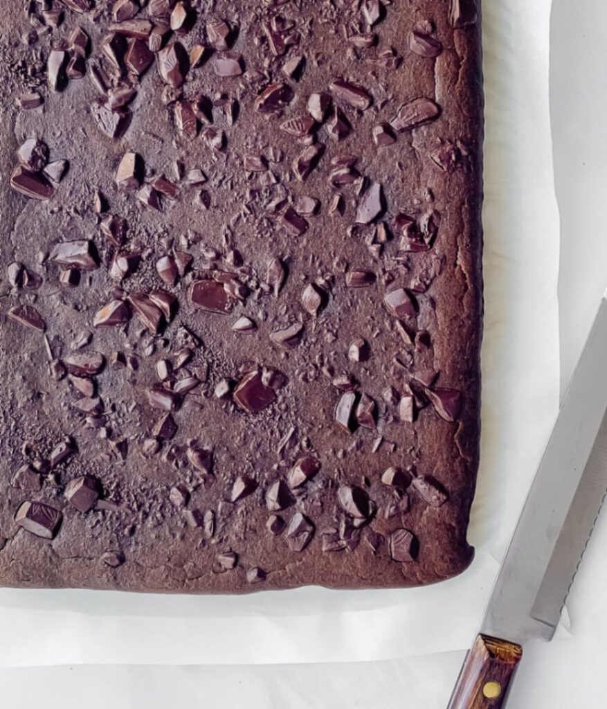 brownies cooling from the oven with knife to the side.