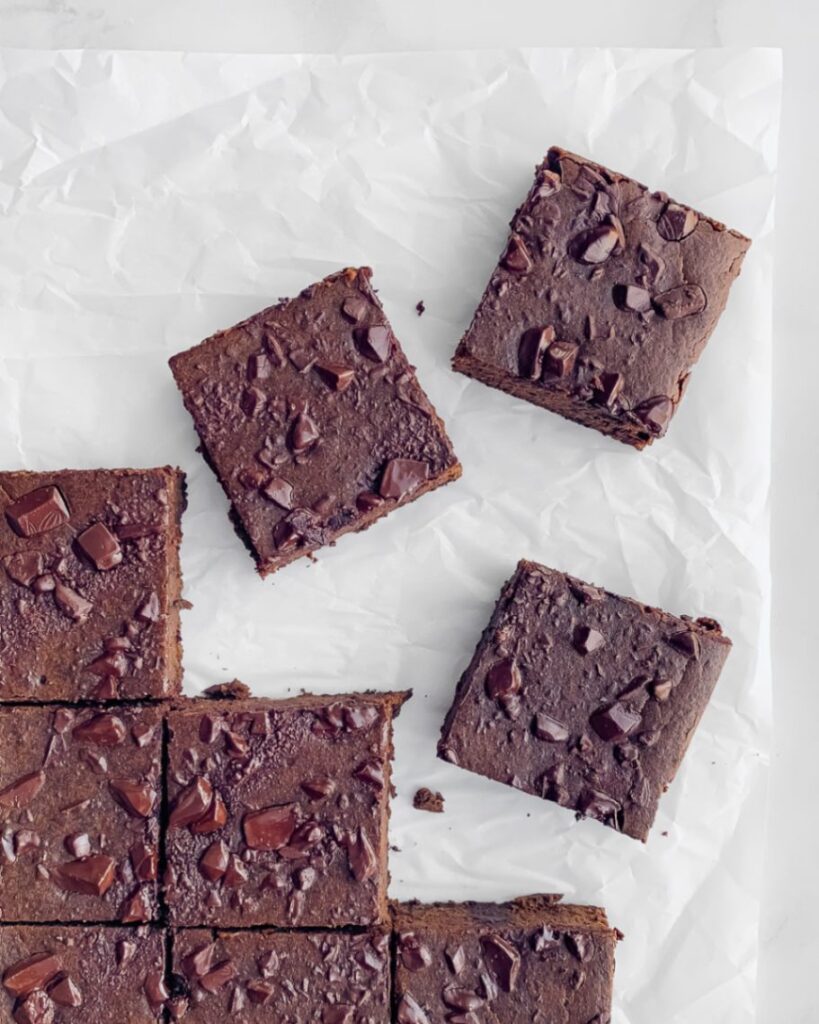 brownie squares on parchment paper.