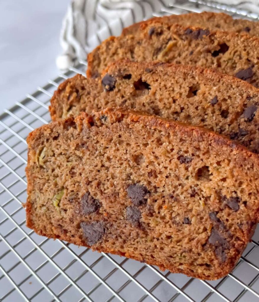 Gluten-free banana zucchini loaf sliced on a wire rack and ready to serve