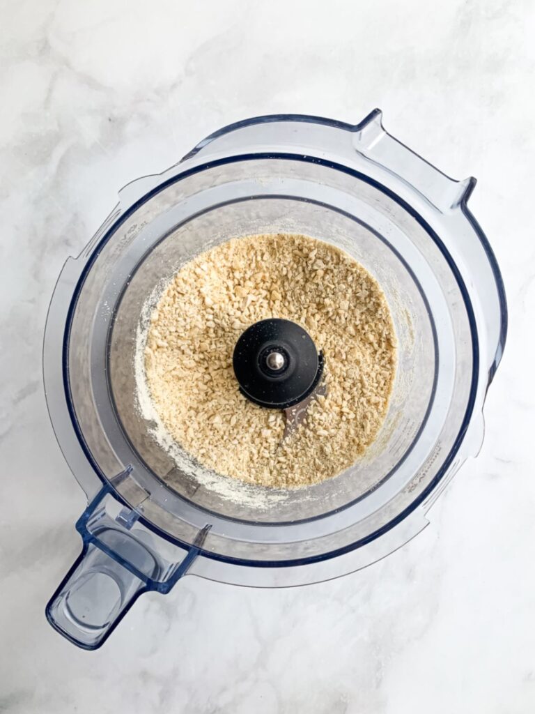 Raw cashews blended into coarse crumbs for blueberry energy balls