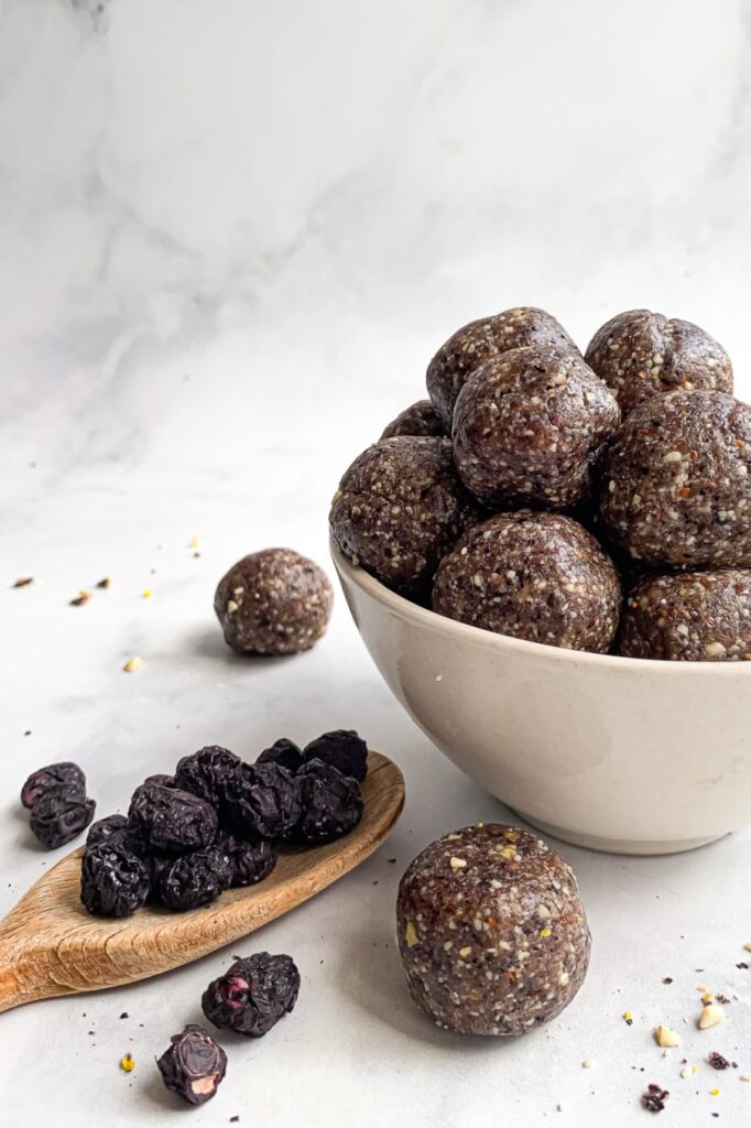 Healthy homemade blueberry energy balls served in a bowl