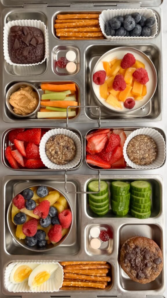 Examples of balanced snacks for kids including fruit, yogurt, hummus, vegetables, eggs, and homemade muffins.